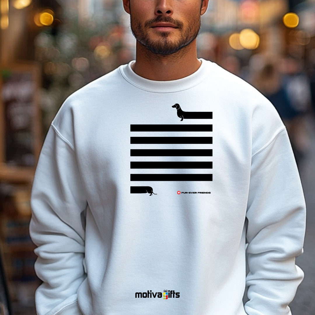 A man wearing a White Dachshund Long on Charm White Sweatshirt featuring a illustration of a dachshund with an extra-long body and quirky charm