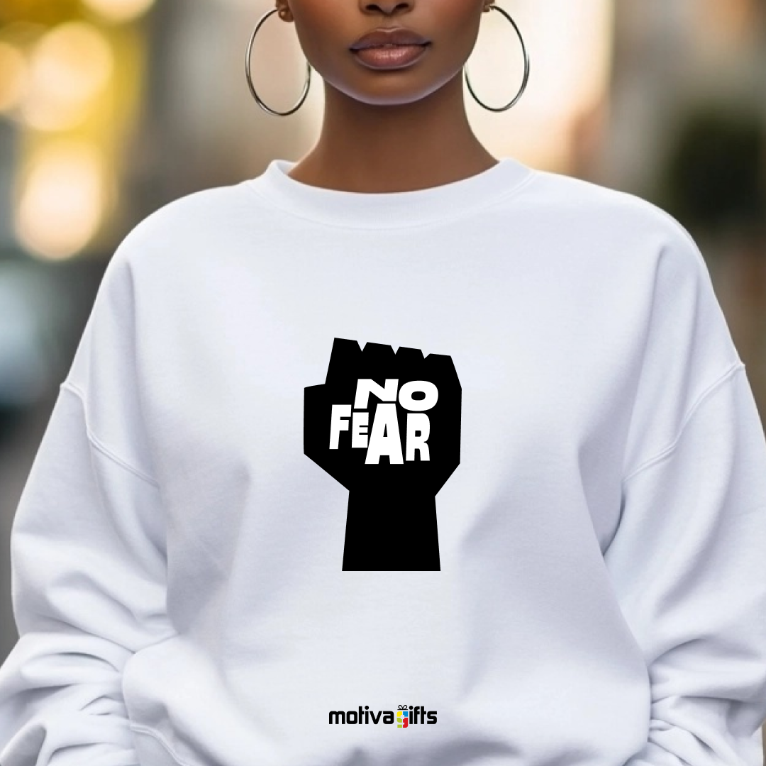 A woman wearing a white sweatshirt featuring bold black typography that reads No Fear