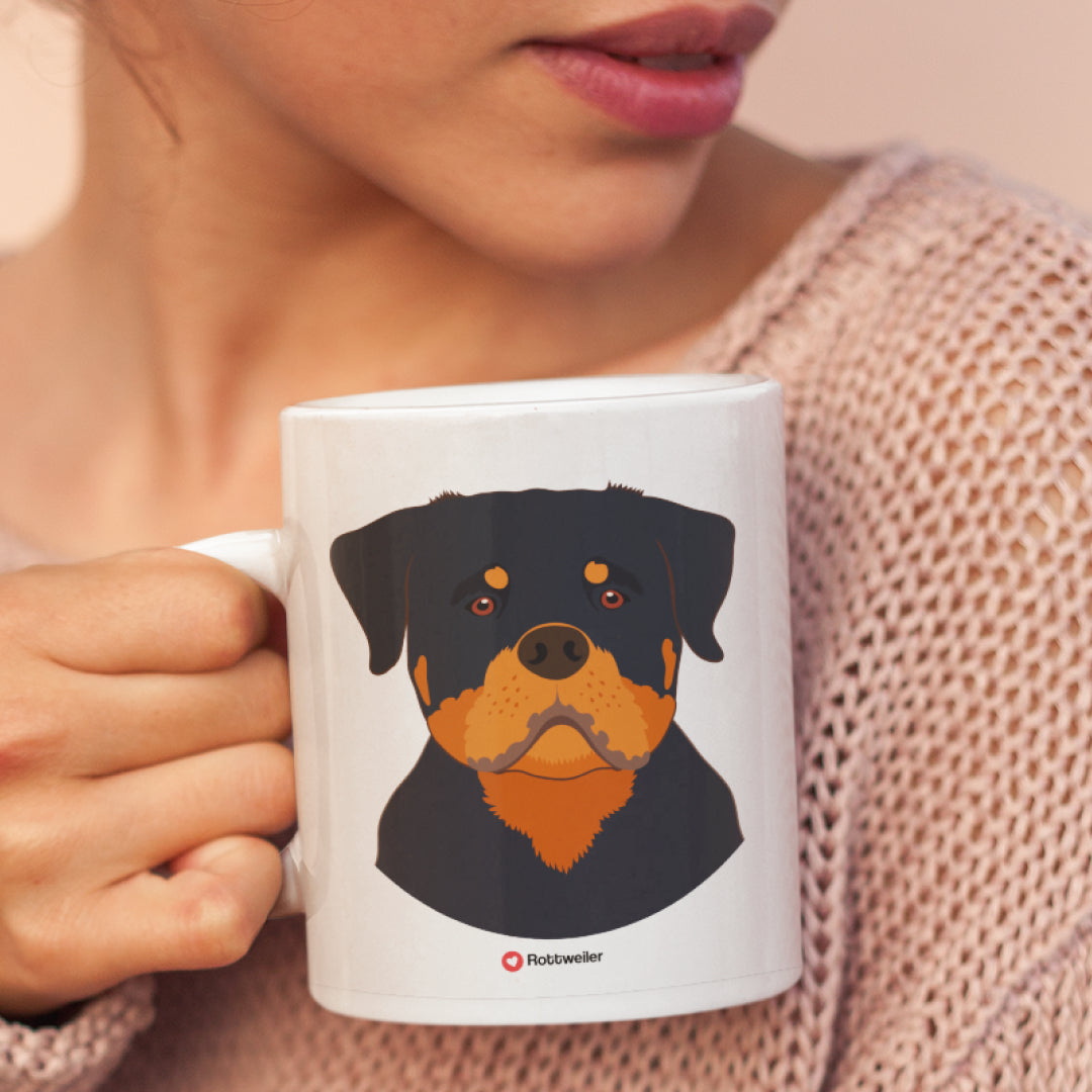 A woman holding a white 11oz ceramic mug featuring Rottweiler Dog art printed on both sides