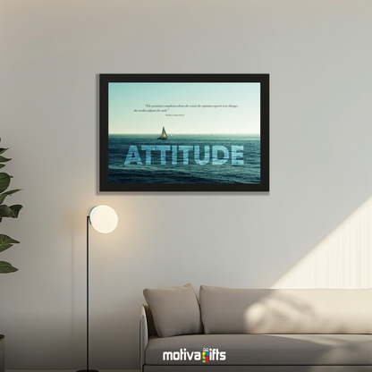 A black framed art wall with the word ATTITUDE in large text and a William Ward quote hangs in a modern living room. 