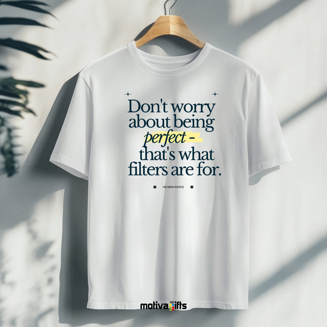 A hanging white T-shirt featuring bold black typography that reads Don’t worry about being perfect - that's what filters are for