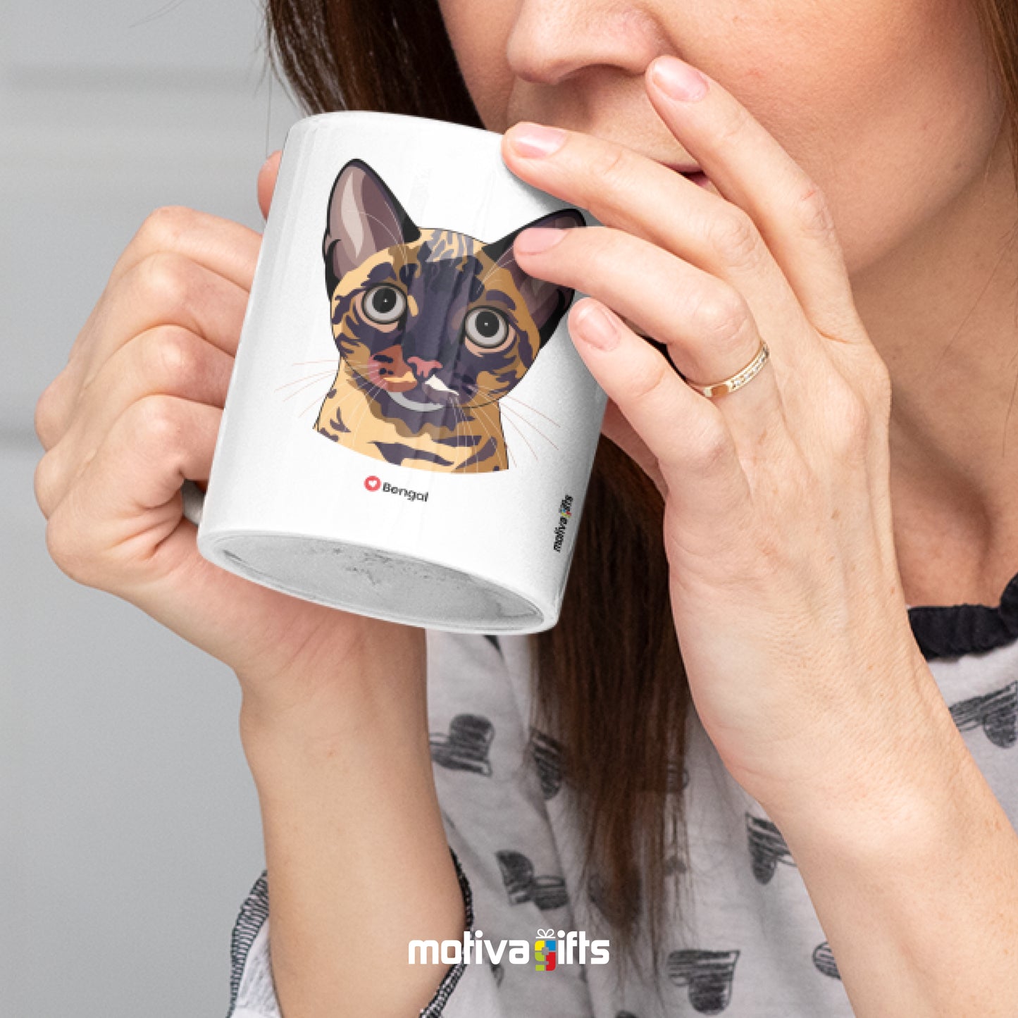 A woman holding a white 11oz ceramic mug featuring Bengal cat love art printed on both sides