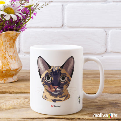 Bengal Love Cat White 11 oz Ceramic Mug next to a flower vase