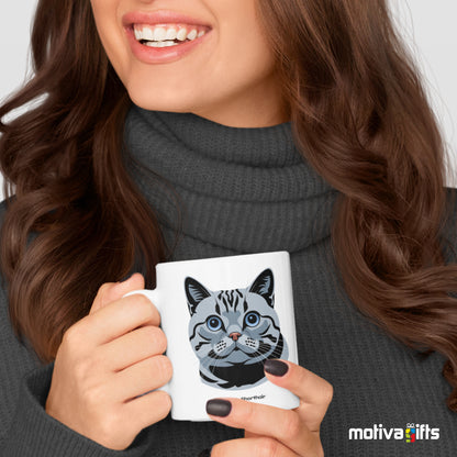 A woman holding a white 11oz ceramic mug featuring British Shorthair cat love art printed on both sides