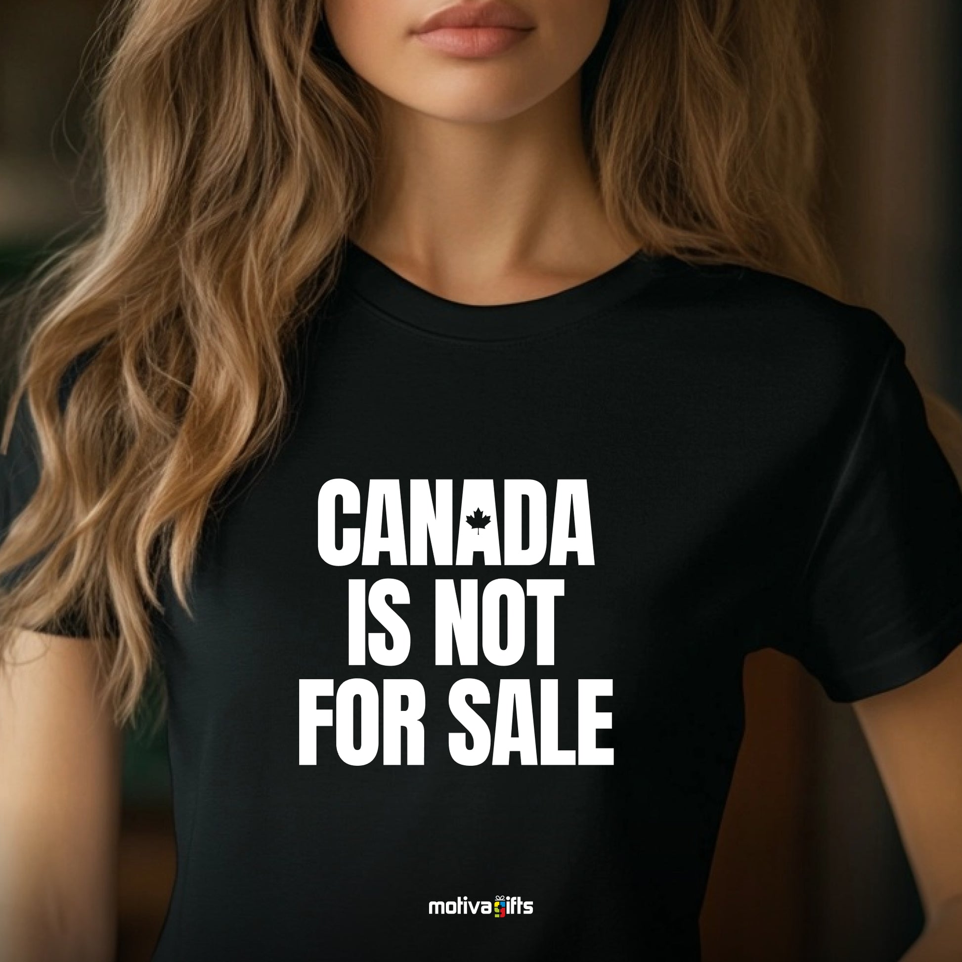 A woman wearing a black T-shirt featuring bold white typography that reads Canada is Not for Sale