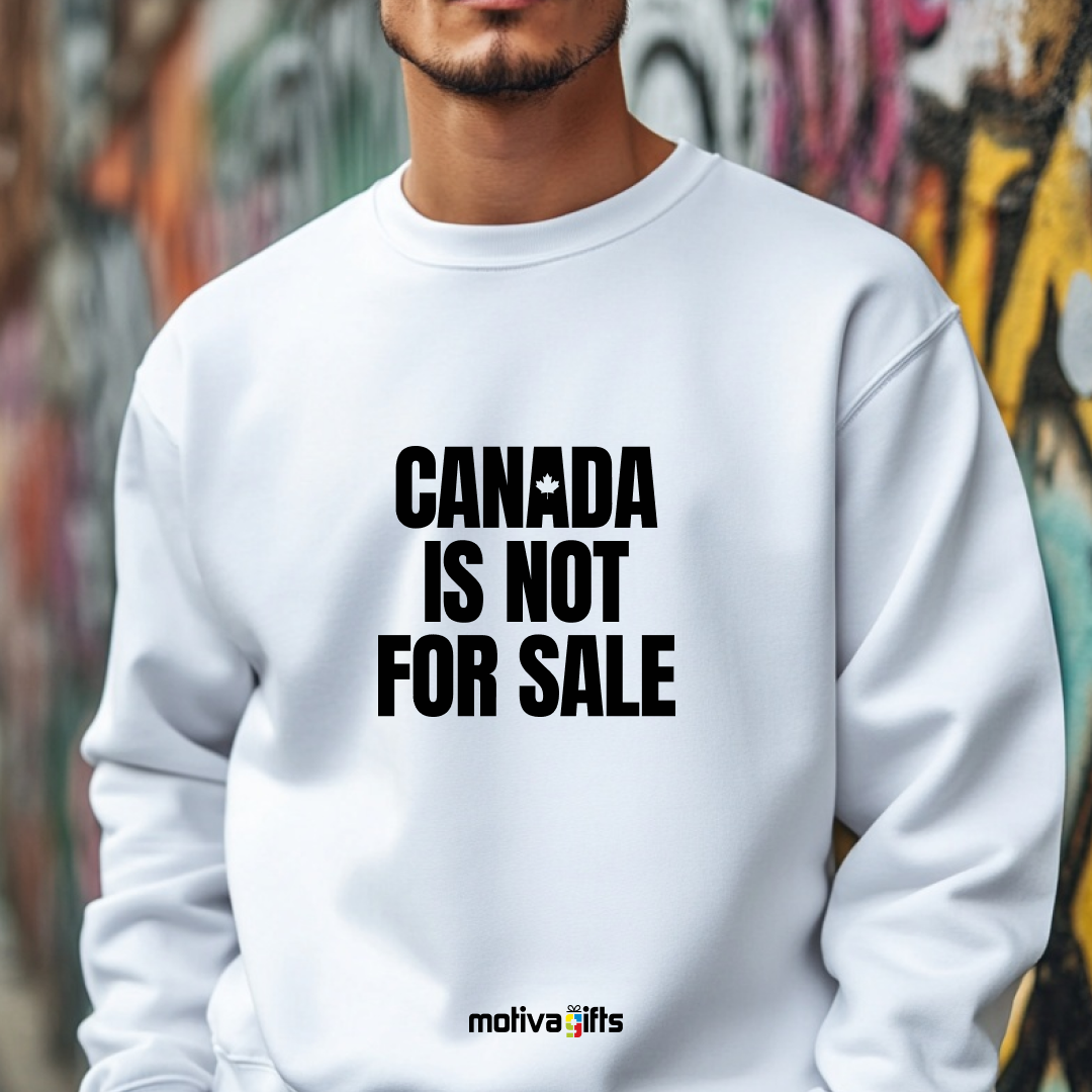 A man wearing a white crewneck sweatshirt featuring bold black typography that reads Canada is Not for Sale