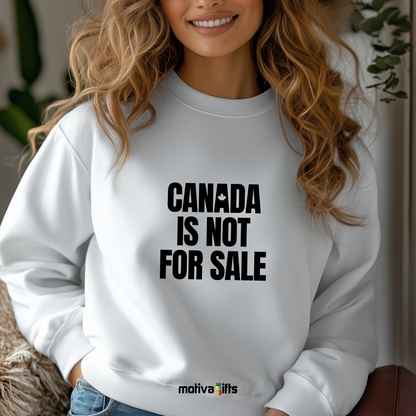 A woman wearing a white crewneck sweatshirt featuring bold black typography that reads Canada is Not for Sale