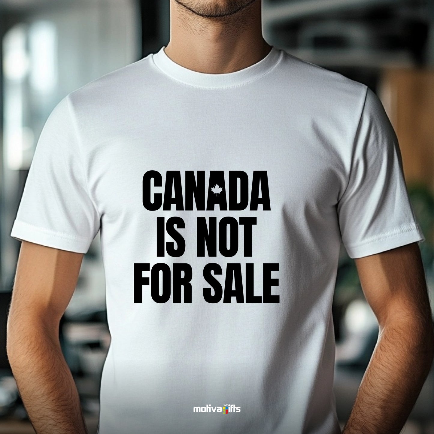 A man wearing a white T-shirt featuring bold black typography that reads Canada is Not for Sale