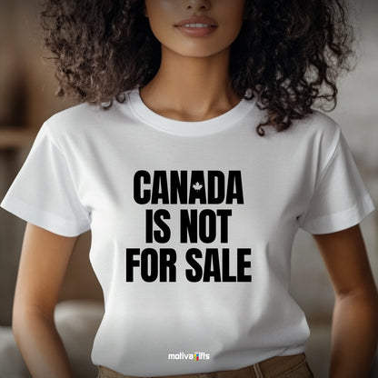 A woman wearing a white T-shirt featuring bold black typography that reads Canada is Not for Sale