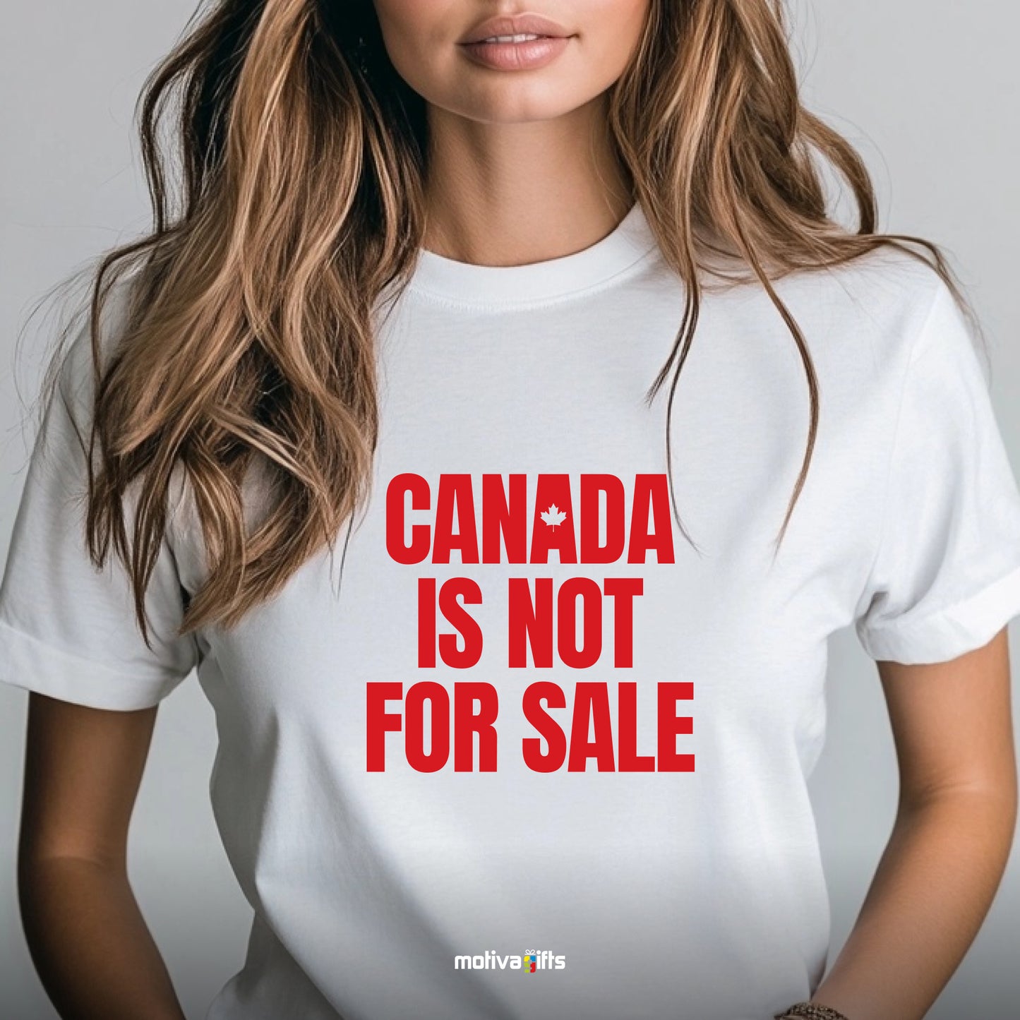 A woman wearing a white T-shirt featuring bold red typography that reads Canada is Not for Sale