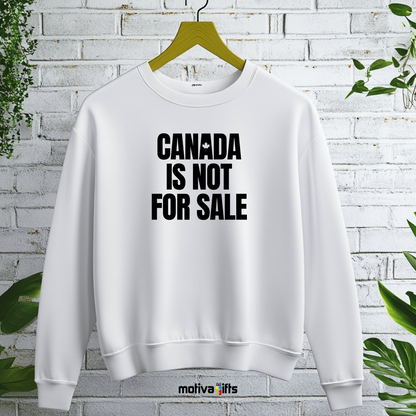 A hanging white sweatshirt featuring bold black typography that reads Canada is Not for Sale