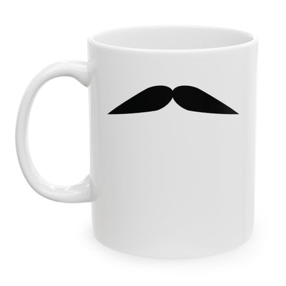 Photo of a white ceramic mug with a drawing of Clark Gable’s mustache, set against a plain white background.