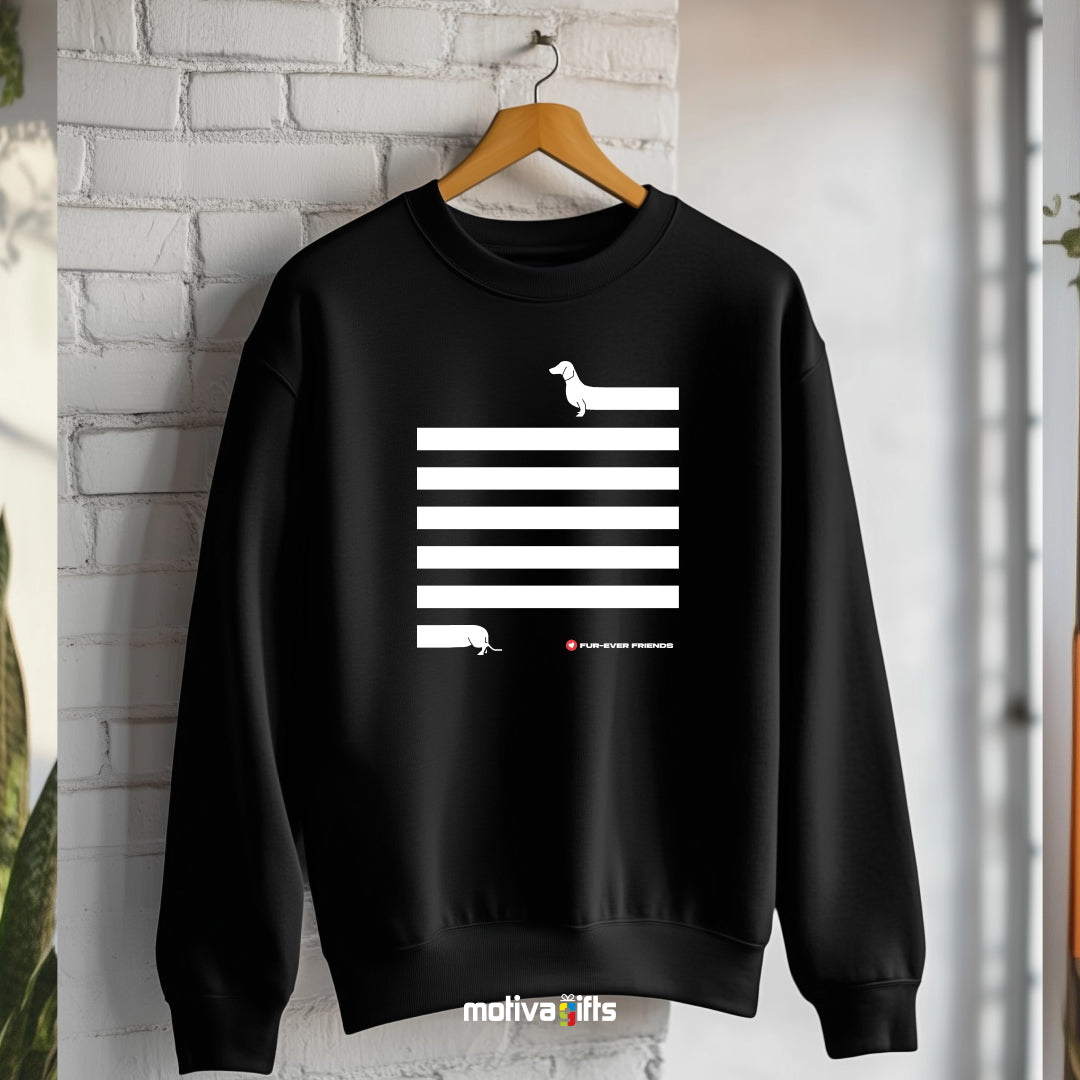 Hanging: black Dachshund Long on Charm Black Sweatshirt featuring a illustration of a dachshund with an extra-long body and quirky charm