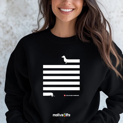 A woman wearing a black Dachshund Long on Charm Black Sweatshirt featuring a illustration of a dachshund with an extra-long body and quirky charm