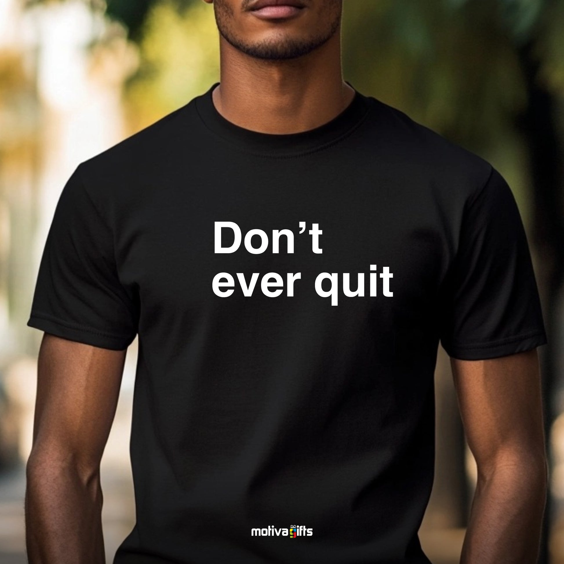  man wearing a black T-shirt featuring bold white typography that reads Don’t ever quit 