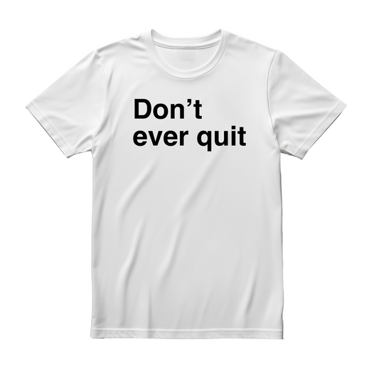 White flat-lay T-shirt featuring bold black typography that reads Don’t ever quit