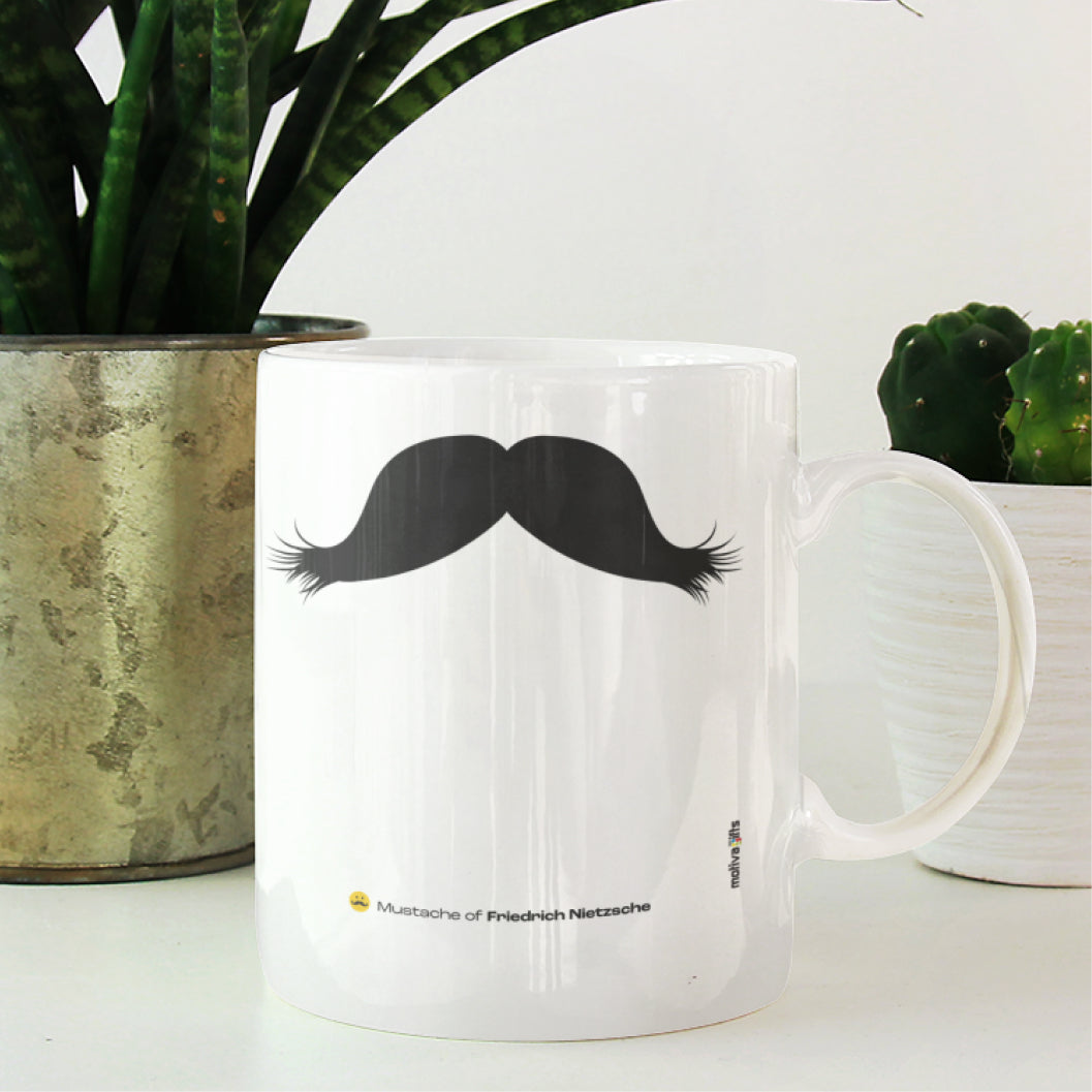 White ceramic mug with a drawing of Friedrich-Nietzsche's mustache featuring small indoor plants 