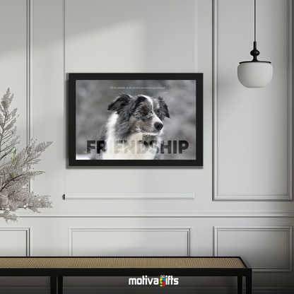 A black framed art wall with the word FRIENDSHIP in large text and a Voltaire quote hangs in a modern living room. 