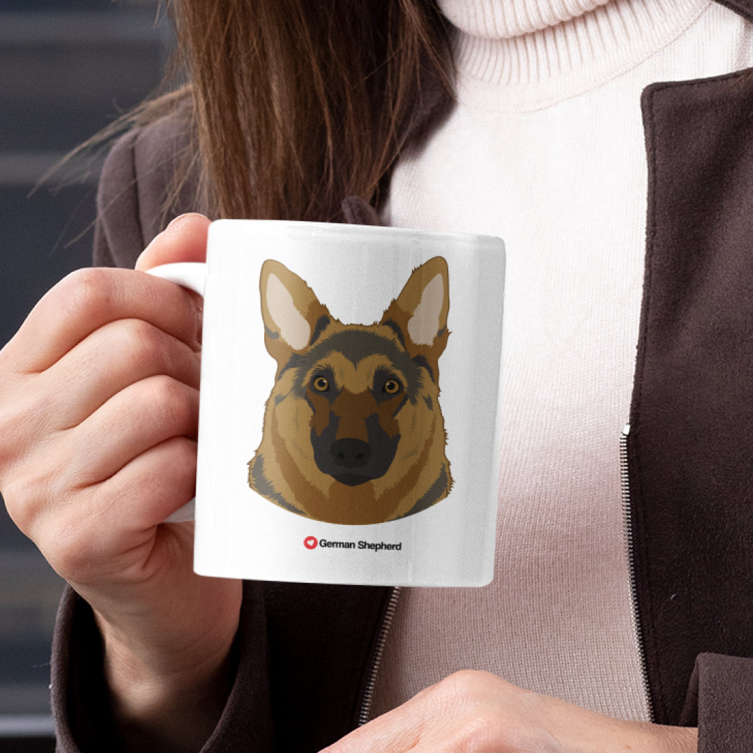 A woman holding a white 11oz ceramic mug featuring German Shepherd Dog art printed on both sides
