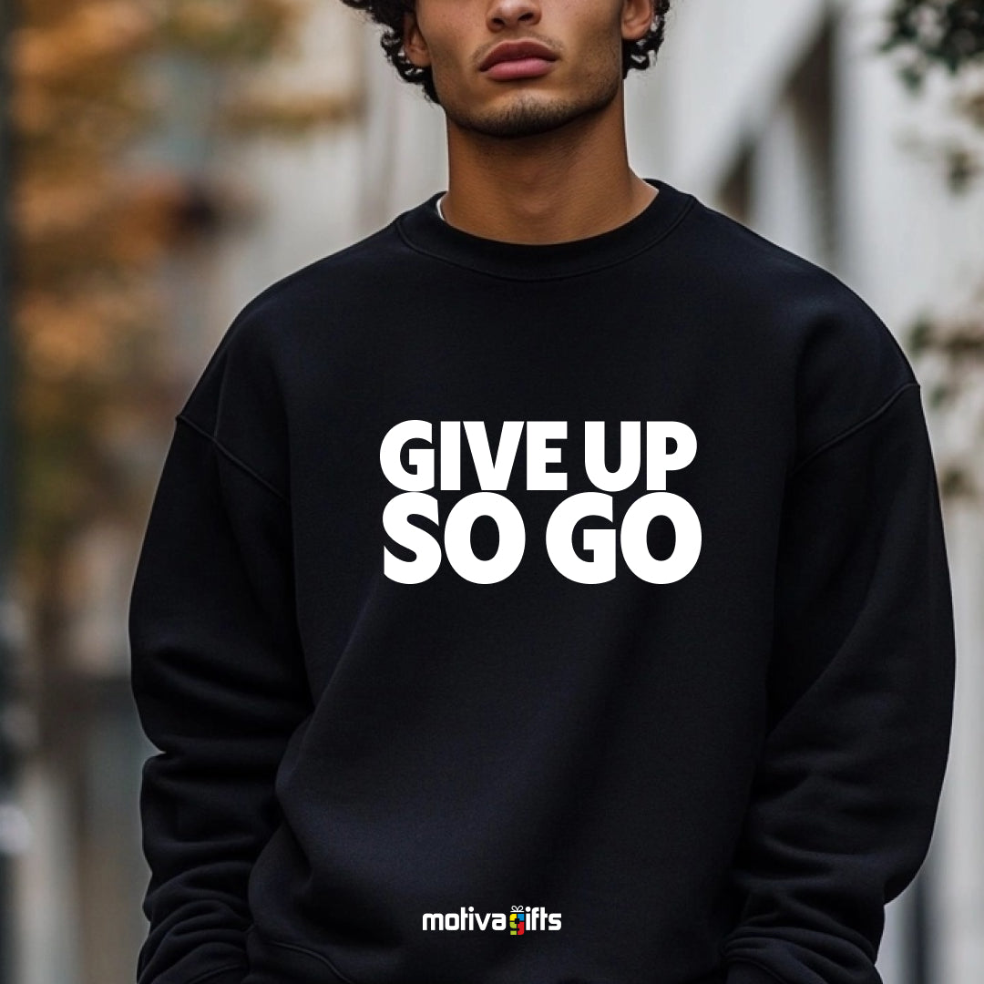 A man wearing a black flat-lay Sweatshirt with white typography that reads Give Up So Go