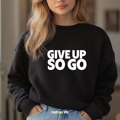A woman wearing a black flat-lay Sweatshirt with white typography that reads Give Up So Go