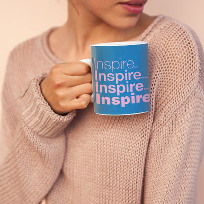 Woman holding a Inspire Wraparound 11 oz Ceramic Blue Mug 