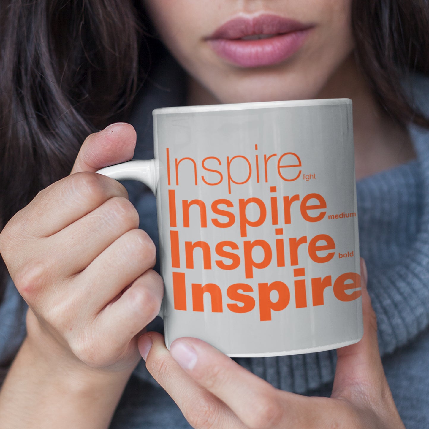 Woman holding a Inspire Grey Wraparound 11 oz Ceramic Mug 