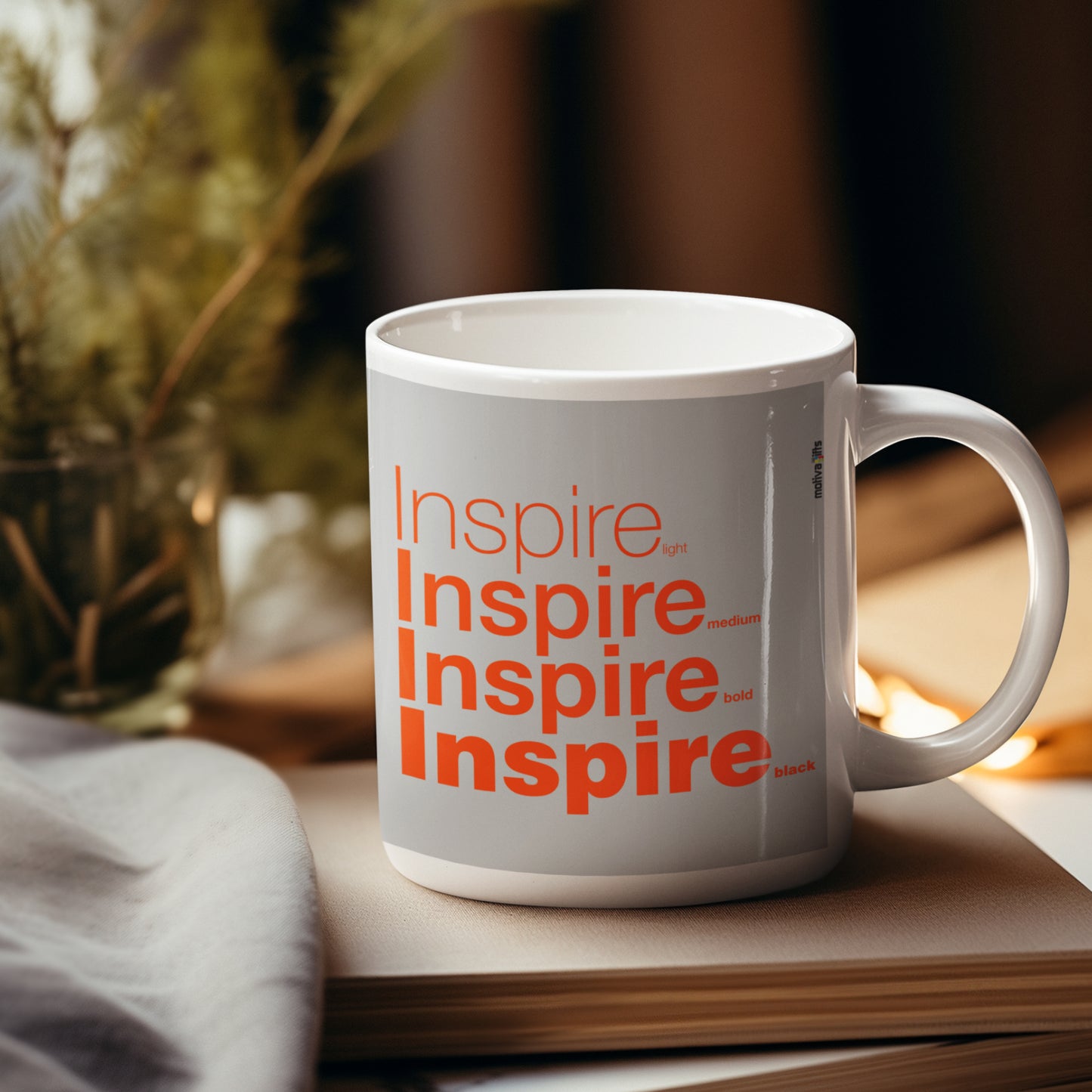 Right View Inspire Grey Mug placed over a wooden table.

