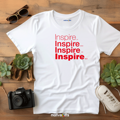 Flatlay image of a White unisex t-shirt with Inspire printed in red on the front in four lines with different font weights (light, medium, bold, black). Made of cotton and polyester, short sleeves, crew neck. By Motiva Gifts.