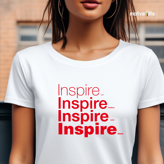 Woman using White unisex t-shirt with Inspire printed in red on the front in four lines with different font weights (light, medium, bold, black). Made of cotton and polyester, short sleeves, crewneck. By Motiva Gifts.