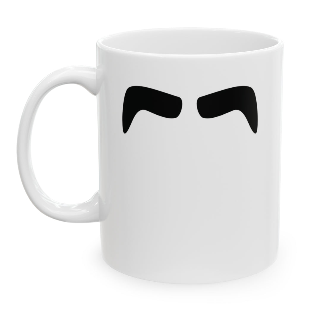 Photo of a white ceramic mug with a drawing of John Lennon’s mustache, set against a plain white background.