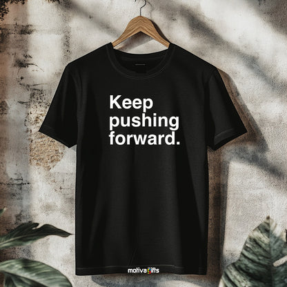 A hanging black T-shirt featuring bold white typography that reads Keep pushing forward 