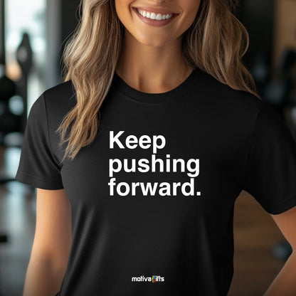 A woman wearing a black T-shirt featuring bold white typography that reads Keep pushing forward