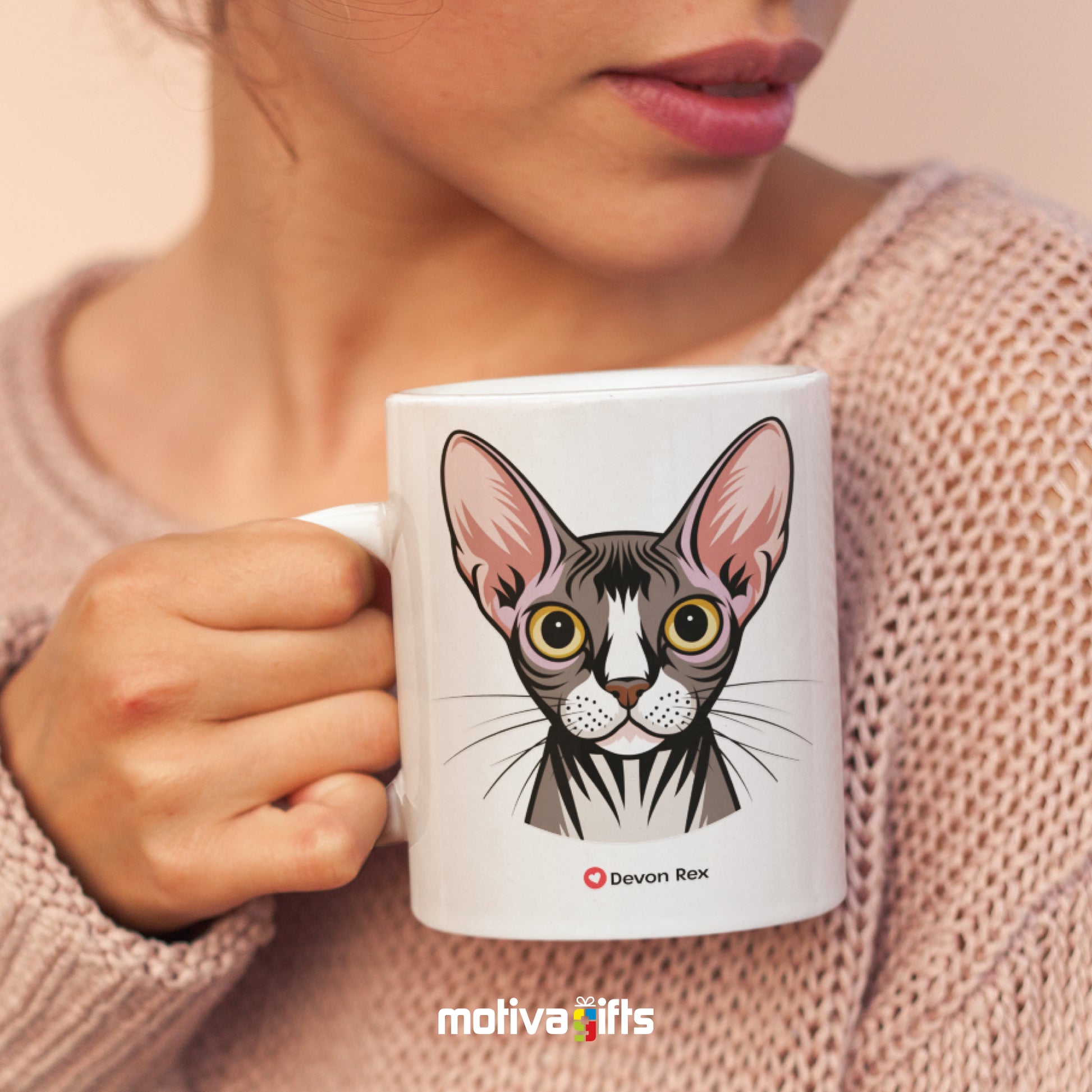 A woman holding a white 11oz ceramic mug featuring Devon Rex cat love art printed on both sides
