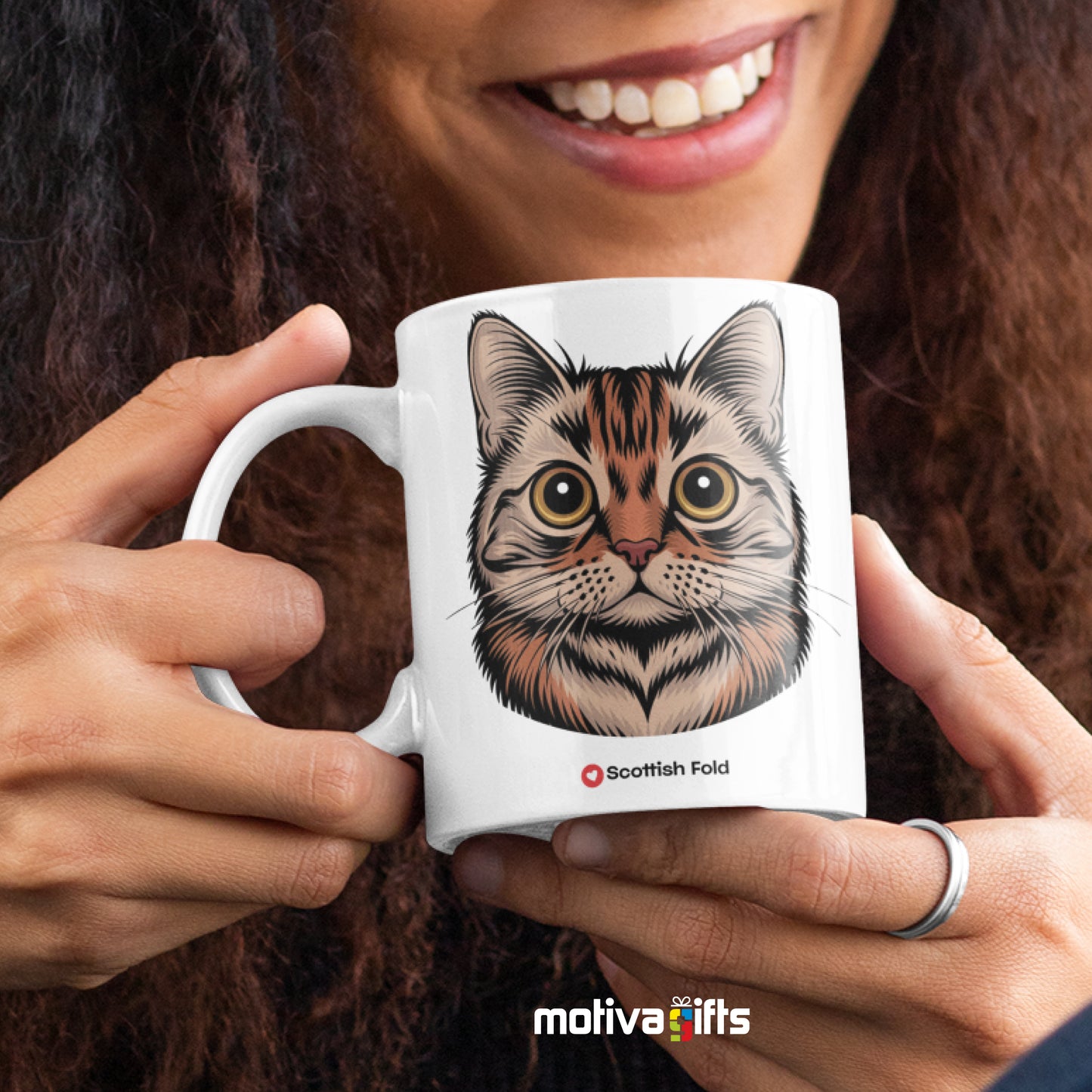 A woman holding a white 11oz ceramic mug featuring Scottish Fold cat love art printed on both sides