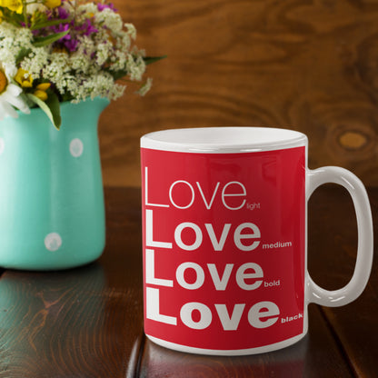 Love Red Ceramic Mug featuring a rustic table and a small vase of flower