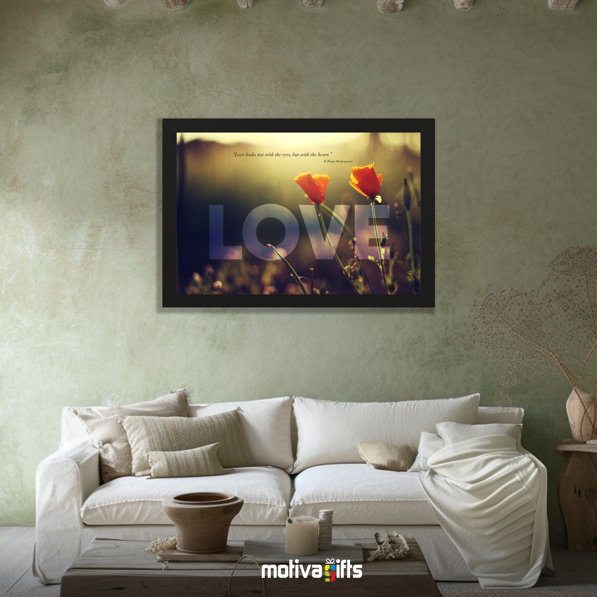 A black framed art wall with the word LOVE in large text and a William Shakespeare quote hangs in a modern living room. 