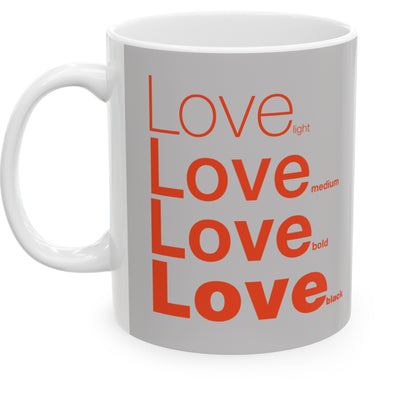 White ceramic mug with a grey wraparound design and the word 'Love' printed in red in four typography styles: light, medium, bold, and black. Clean white background