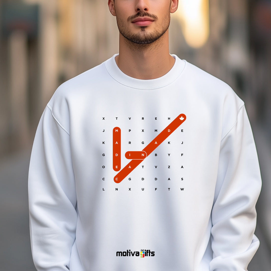 A man wearing of a Crossword white T-shirt featuring bold white typography that reads Made in Canada