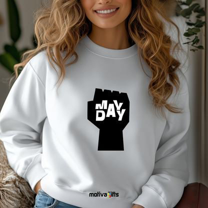 A woman wearing a white sweatshirt featuring bold black typography that reads May Day  