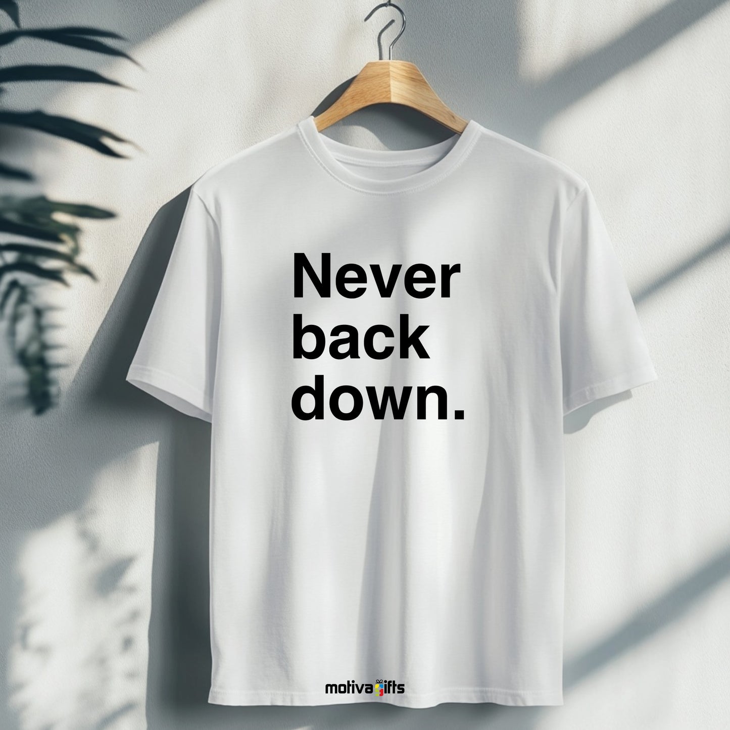 A hanging white T-shirt featuring bold black typography that reads Never back down 