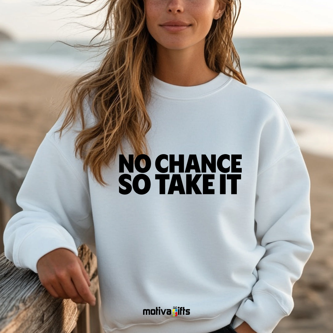 A woman wearing a white flat-lay Sweatshirt with black typography that reads No Chance So Take It