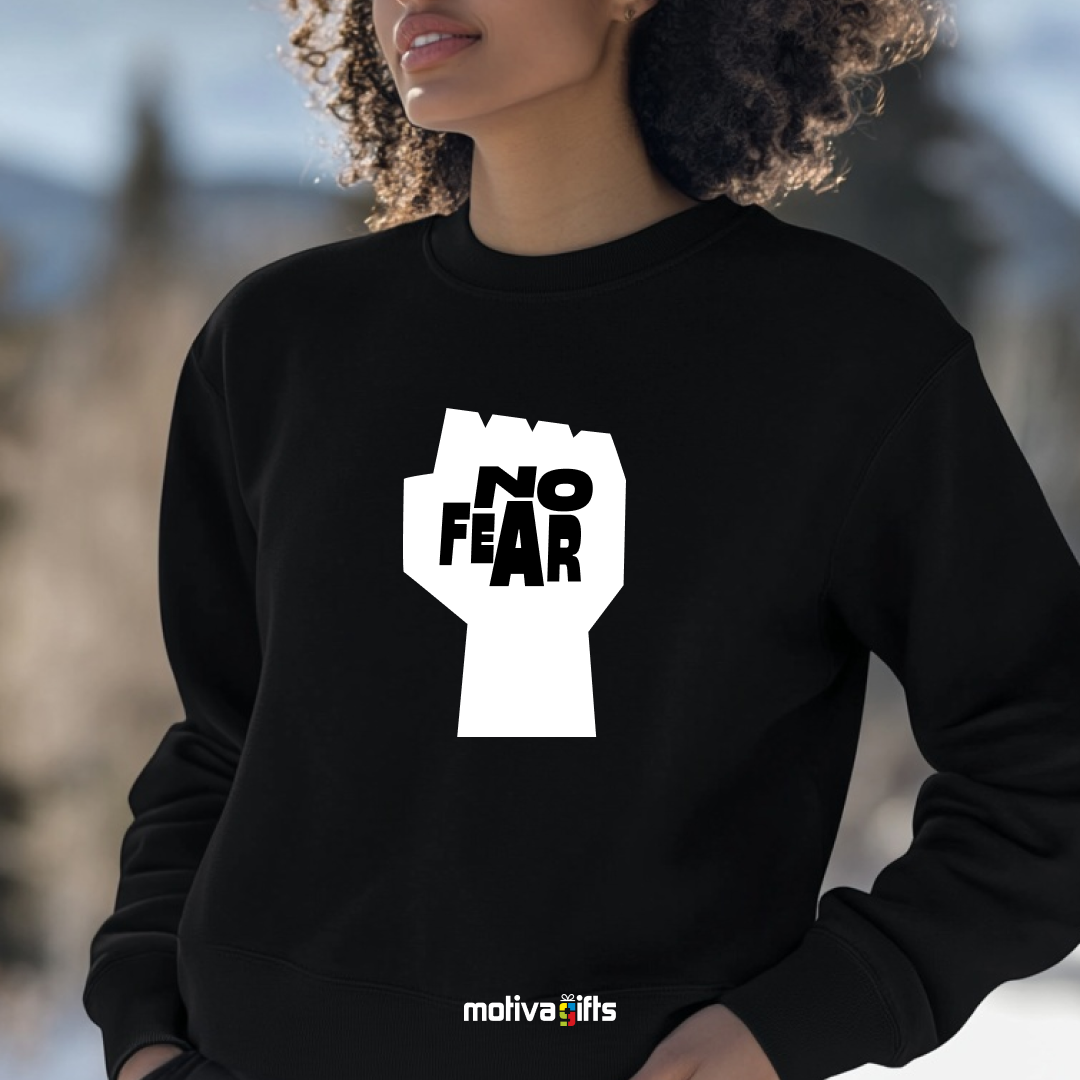 A woman wearing a black sweatshirt featuring bold white typography that reads No Fear 