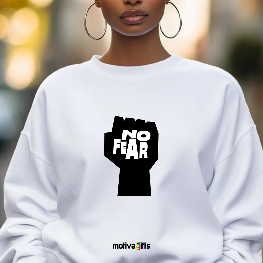 A woman wearing a white sweatshirt featuring bold black typography that reads No Fear 