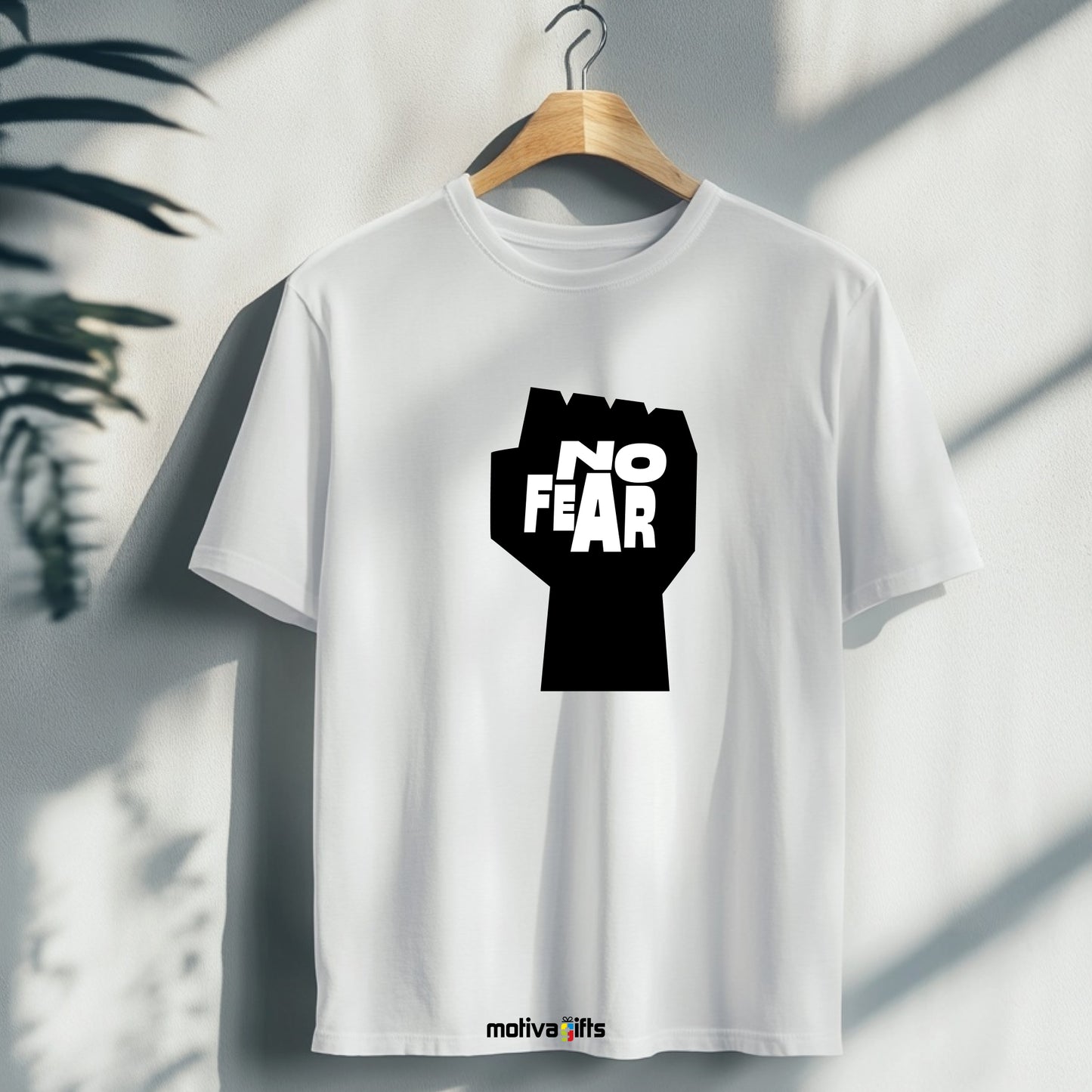 A hanging white T-shirt featuring bold black typography that reads No fear 