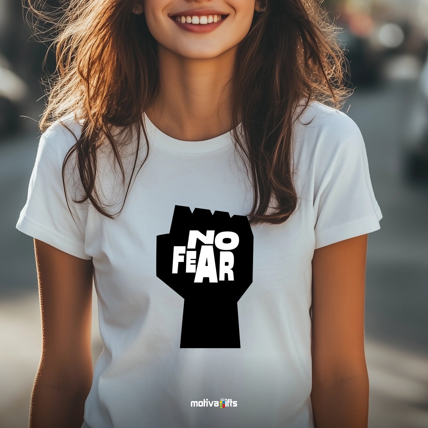 A woman wearing a white T-shirt featuring bold black typography that reads No fear 
