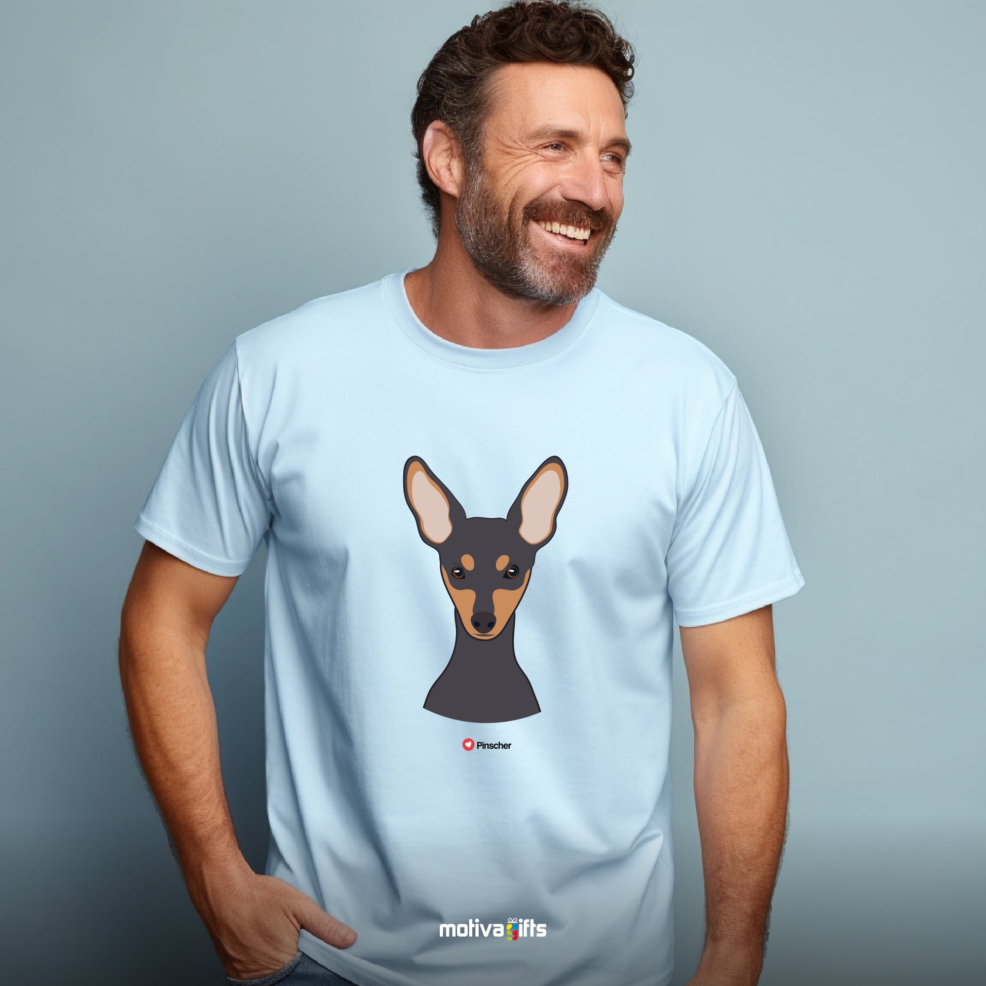 Man wearing light blue tshirt with Pinscher design on the front, front view, by Motiva Gifts.