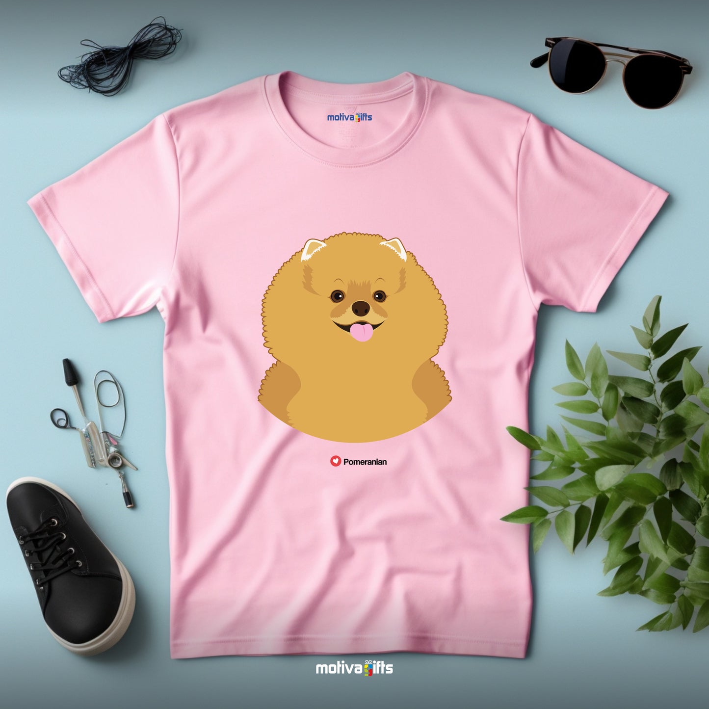 Flatlay, tshirt light pink with Pomeranian design on the front, front view, by Motiva Gifts.