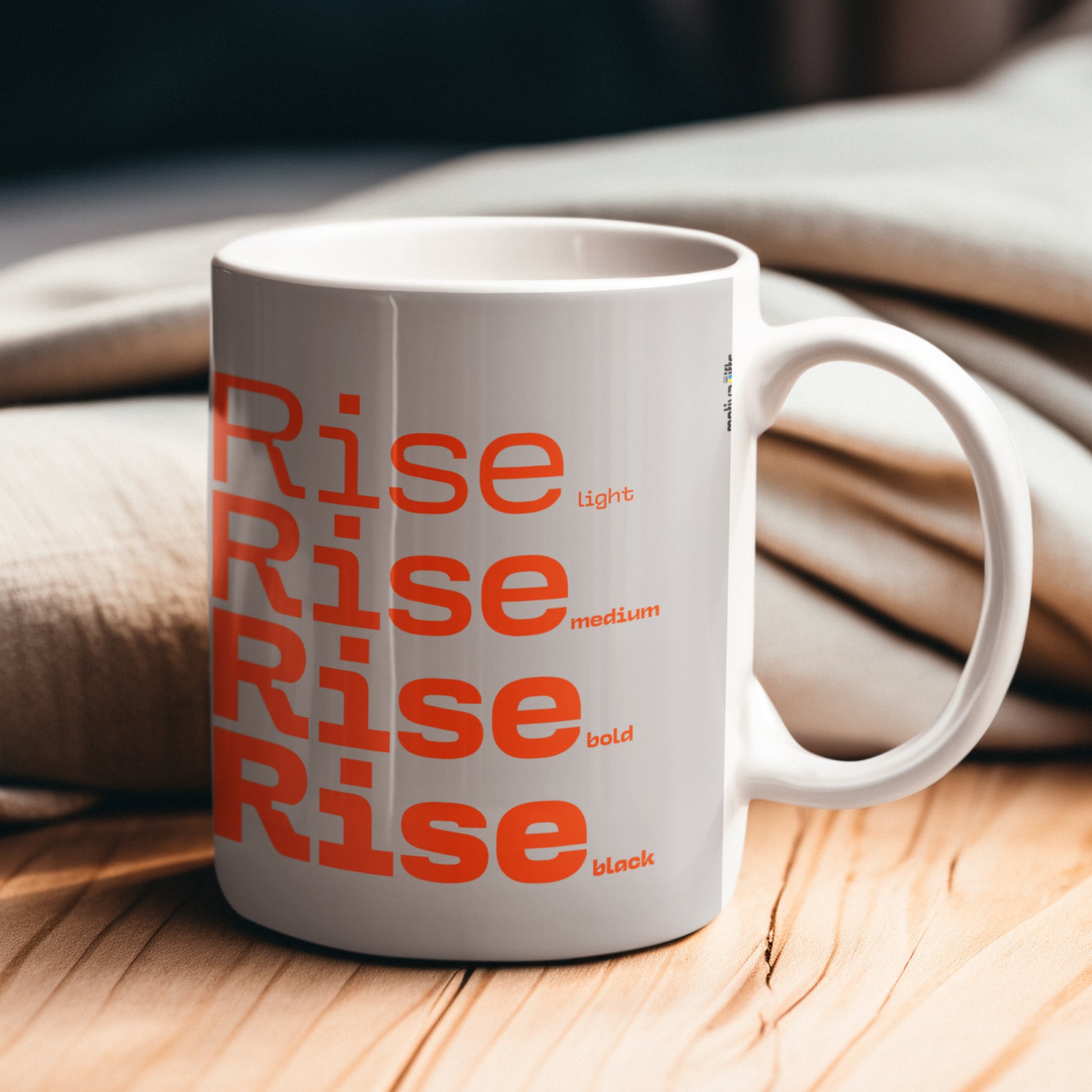 Rise Grey Mug placed on a wooden table