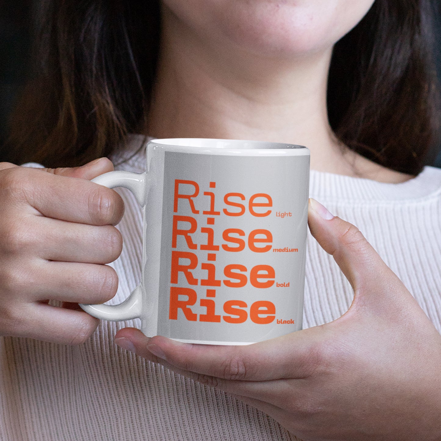 Woman holding a Rise Grey Ceramic Mug